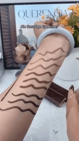 Waterproof eyeliner shade swatches applied smoothly on an arm